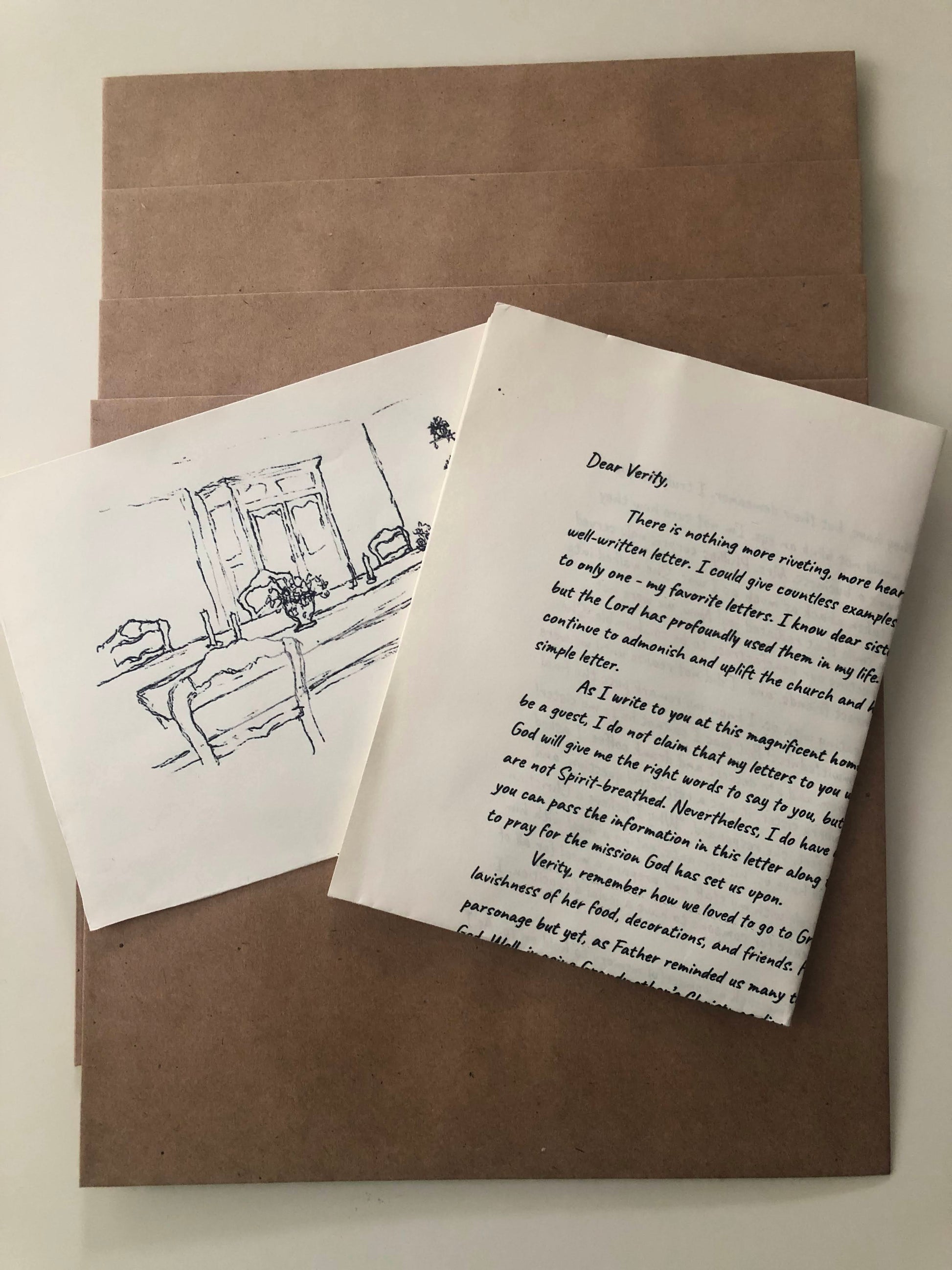 Verity Letters is a Christian letter subscription. A letter and sketch are included in each envelope. The  image includes six envelopes and the sketch and letter for our six month subscription plan. 